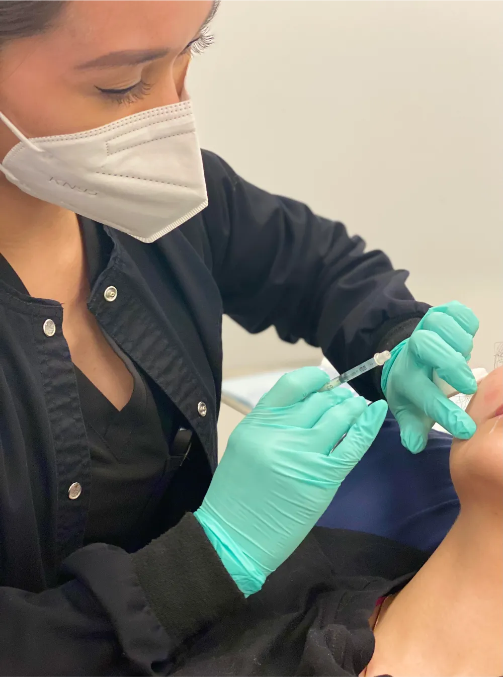 Photo of a patient receiving a cosmetic injection of botox.